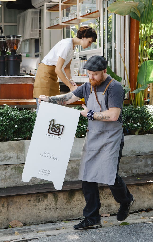 Coworkers preparing cafeteria for opening in street